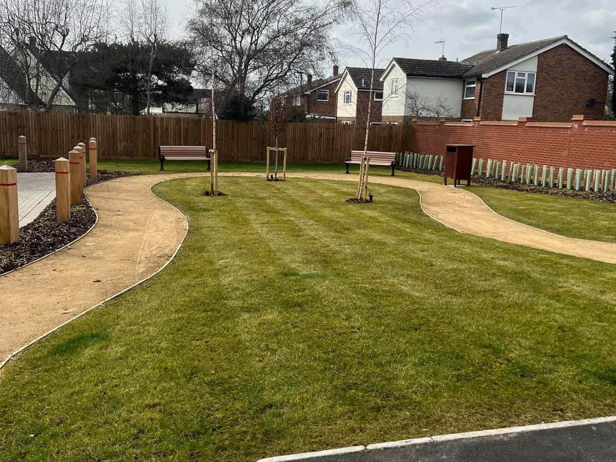 Mown green with gravel paths and benches